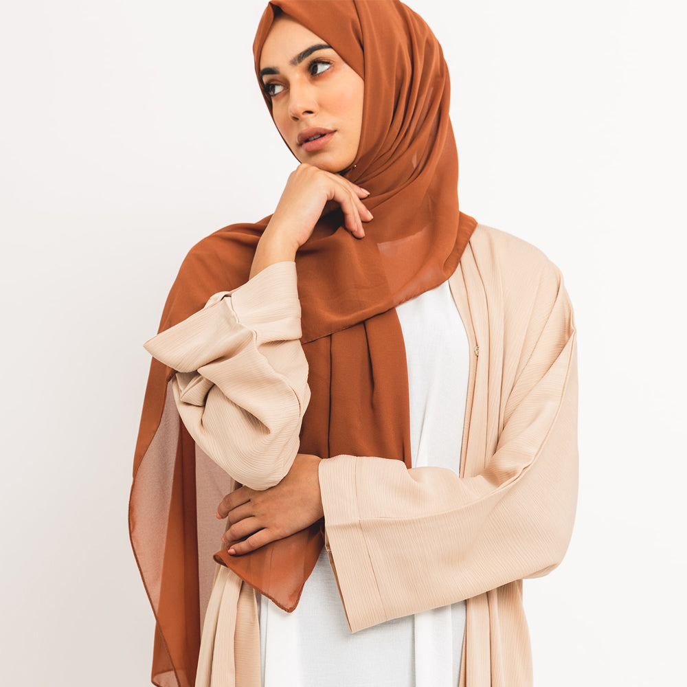 Apri la crema essenziale abaya